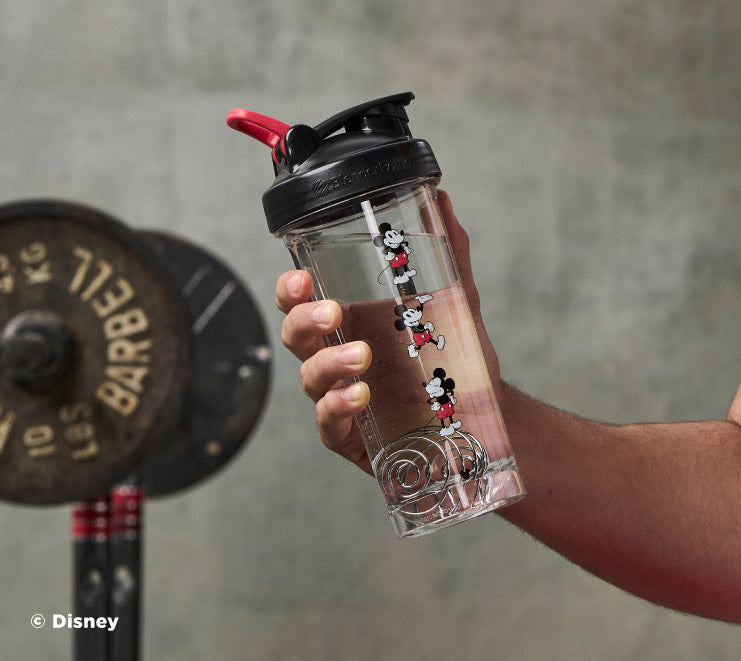 pro-series-g6 Mickey_Mouse_Protein_Shaker_Bottle_Being_Held_In_the_Gym.jpg